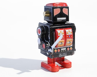 Svart robot med svärd plåtleksak samlarobjekt