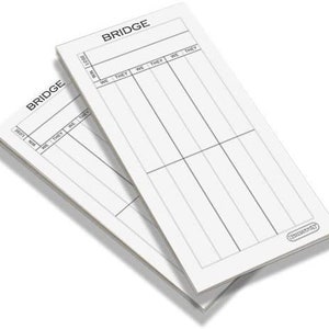 May include: Two white scorecards for the game of bridge. The scorecards have the word "BRIDGE" printed at the top and columns labelled "WE" and "THEY".
