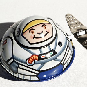 Ovales Spaceman Uhrwerk Blechspielzeug