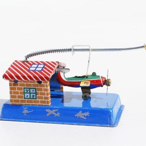 Aeroplane hangar tin toy