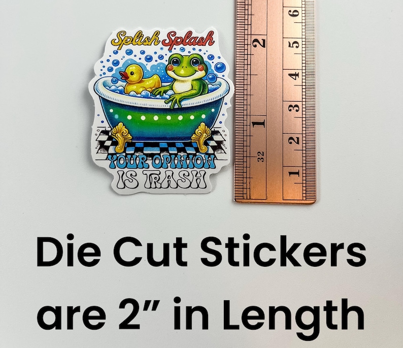 May include: Die-cut sticker featuring a green frog and a yellow rubber ducky in a bathtub with the text "Splish Splash Your Opinion Is Trash" printed on a white background. The sticker is 5 cm long.