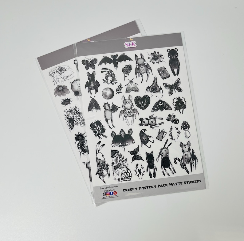 May include: Two sheets of matte stickers featuring black and white illustrations of creepy creatures, including bats, moths, mushrooms, and other spooky designs. The text "Creepy Mystery Pack Matte Stickers" is printed at the bottom of the sheet.