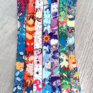 May include: A set of ten colorful lanyards featuring various Pokemon characters. The lanyards are made of a soft, durable material and are perfect for holding keys, ID badges, or other small items.