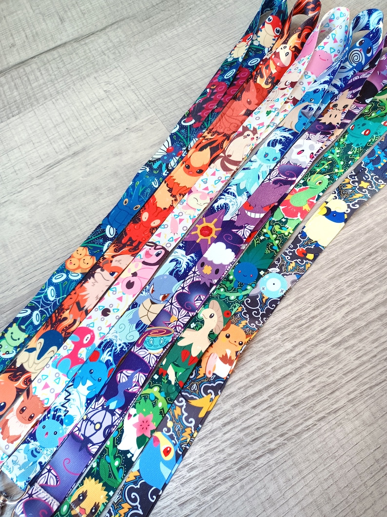 May include: A set of 10 colorful lanyards featuring different Pokemon characters. Each lanyard has a unique design with a variety of colors and patterns.