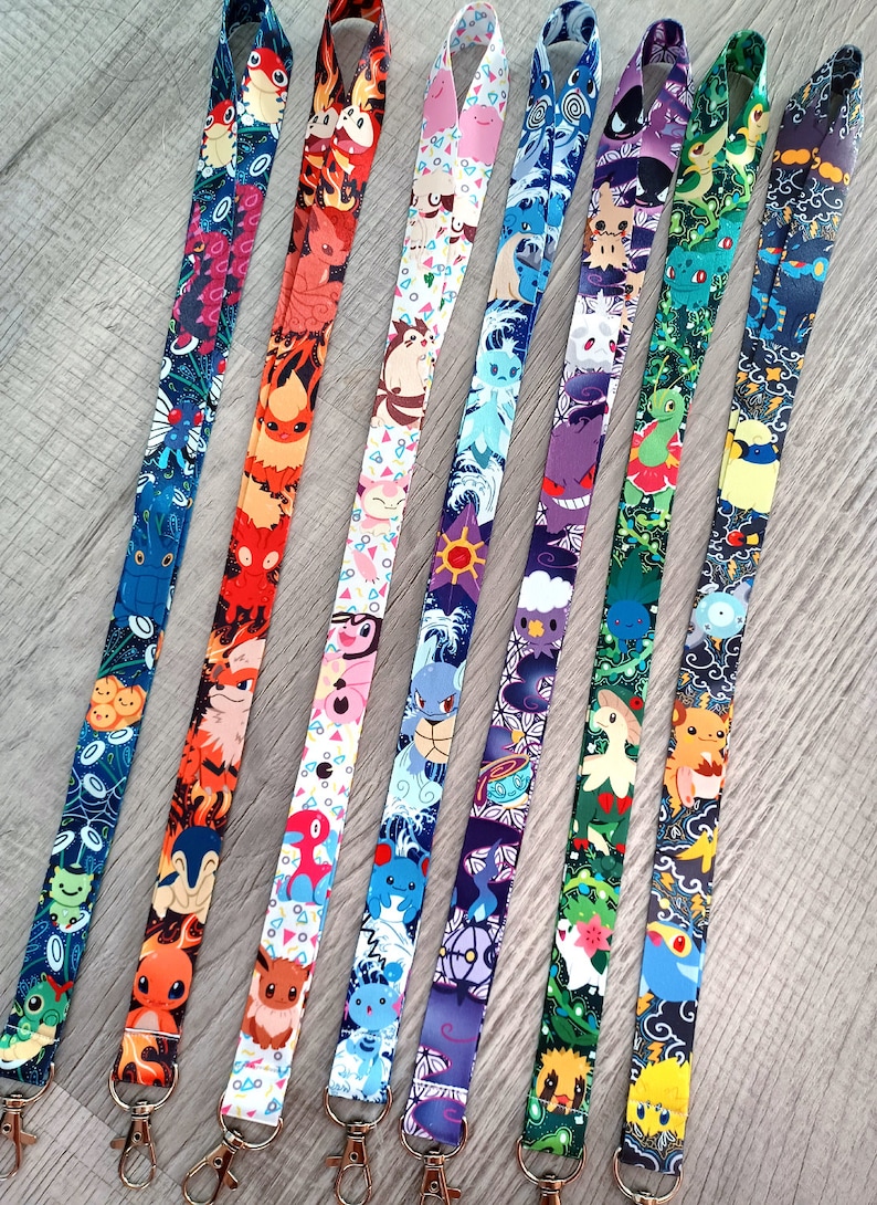 May include: Eight colorful lanyards with different Pokemon characters printed on them. The lanyards are all about 20 inches long and have a metal clip at the end.