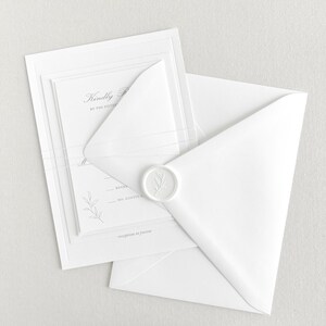 Classic floral RSVP card. Shown stacked with white RSVP envelope and enclosed in a white fine twine wrap. Paired with matching white envelope and white wax seal.