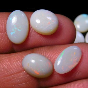 AA White Australian Opal Cabochons: 7-Piece Oval Gemstone Set