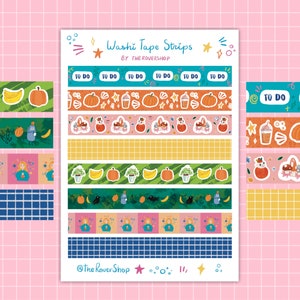 May include: A sheet of washi tape strips with various designs, including pumpkins, plants, and the text "TO DO." The tape is in multiple colors, with the text "Washi Tape Strips" and "BY THE ROVERSHOP" at the top.