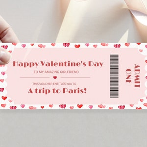 May include: A pink and white ticket with a red heart border and the text "Happy Valentine's Day" and "A trip to Paris!"  The ticket also has a barcode and the text "ADMIT ONE".