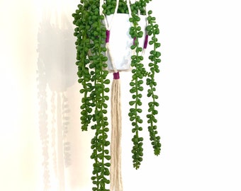 Simple modern white and purple macrame plant hanger for medium pots