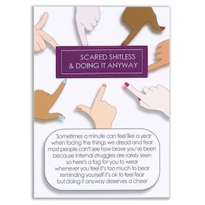 May include: A purple tag with the text "Scared Shitless & Doing It Anyway" surrounded by six cartoon hands pointing at the tag. The text below the tag reads "Sometimes a minute can feel like a year when facing the things we dread and fear most people can't see how brave you've been because internal struggles are rarely seen so here's a tag for you to wear whenever you feel it's too much to bear reminding yourself it's ok to feel fear but doing it anyway deserves a cheer."