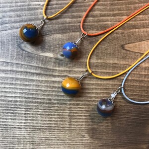 Vintage marbles crafted into pendant necklaces