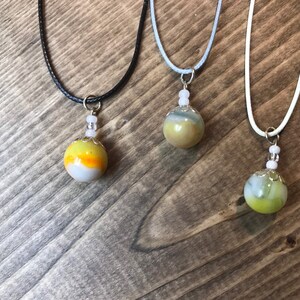Vintage marbles crafted into pendant necklaces