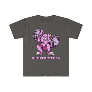 May include: Dark grey t-shirt featuring a cartoon rabbit lifting weights. The rabbit is pink and muscular, wearing pink shorts and sneakers. The barbell has purple weights. The word "Pumpernickel" is printed below the rabbit in pink.