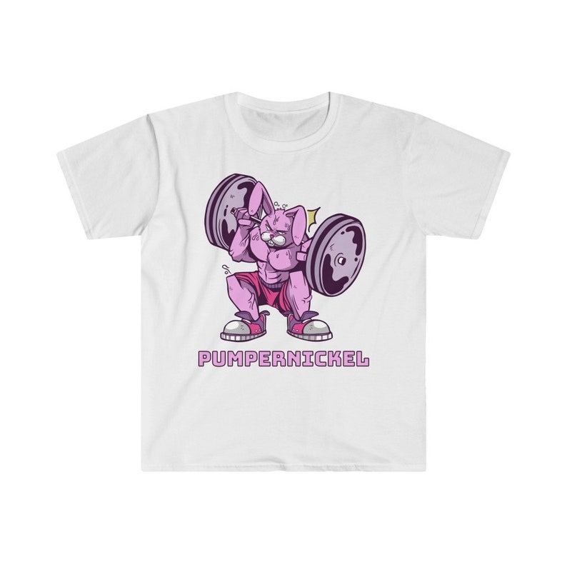 May include: White t-shirt featuring a cartoon rabbit lifting weights. The rabbit is pink and muscular, wearing red shorts and sneakers. The text "PUMPERNICKEL" is printed below the rabbit in a purple font. A fun and unique design.