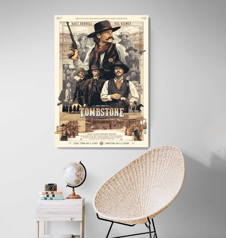 May include: A vintage-style movie poster for the film "Tombstone" featuring Kurt Russell and Val Kilmer. The poster is illustrated in a sepia tone with a western town scene in the background. The text "Tombstone" is in a large, bold font.