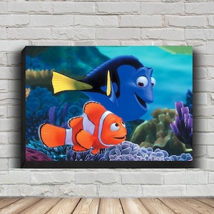 May include: A blue and yellow tang fish and an orange and white clownfish swim together in a coral reef. The tang fish is smiling and the clownfish is looking at the tang fish.