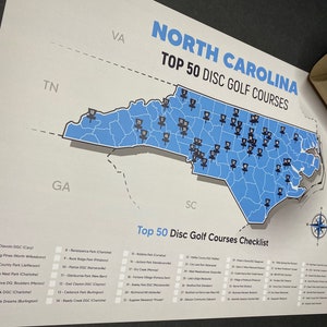 May include: A map of North Carolina with blue and white colors showing the top 50 disc golf courses in the state. The map includes a checklist of the courses with their names and locations.