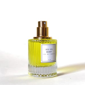 marshmallow milk perfume with rose in a glass perfume bottle