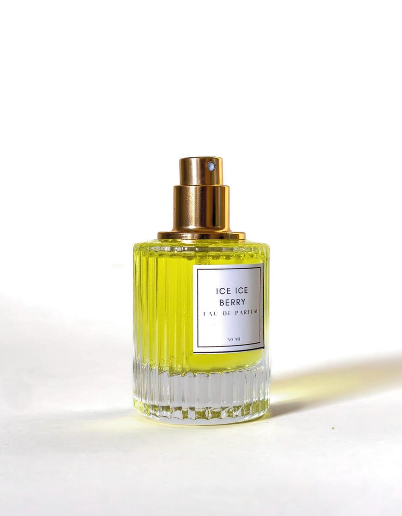 marshmallow milk perfume with rose in a glass perfume bottle