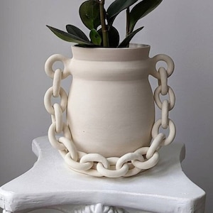 Handcrafted porcelain ceramic planter with saucer and a chain