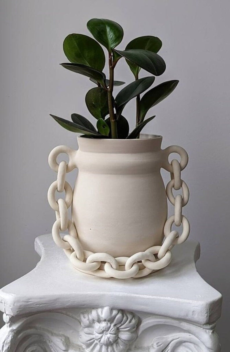 Handcrafted porcelain ceramic planter with saucer and a chain