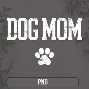 May include: White text on a gray background that reads "DOG MOM" with a white paw print below. The text has a distressed look. The image has a white border at the bottom with the word "PNG" in black text.
