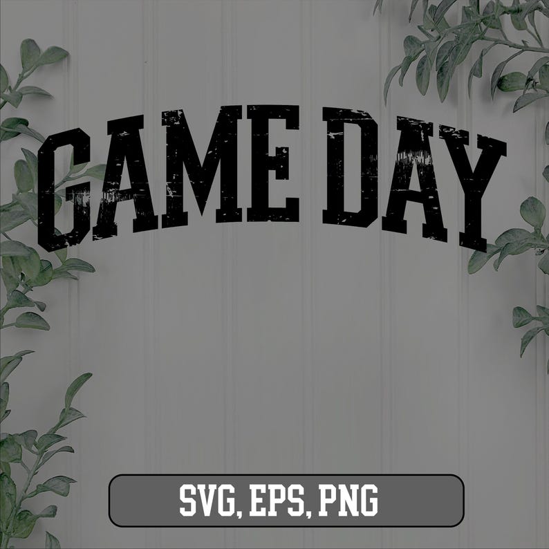 May include: Black and white graphic text that reads "GAME DAY" with a distressed, vintage look. The text is in a bold, blocky font. The background is a white wood panel.