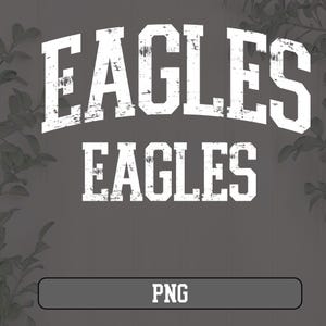 May include: White text on a gray background reads "Eagles" twice, once in a larger font size and once in a smaller font size. The text has a distressed, vintage look.