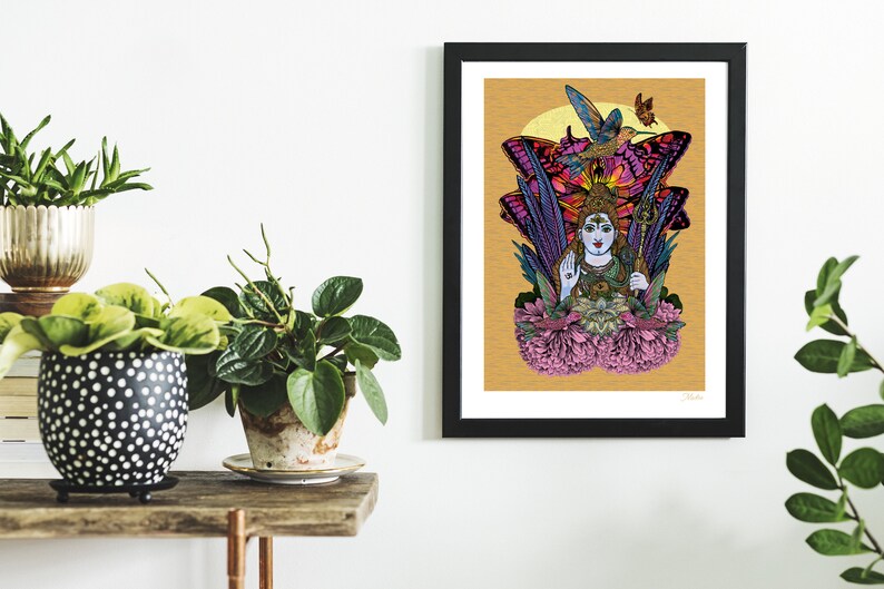 May include: A colorful illustration of a Hindu deity, Shiva, surrounded by butterflies and flowers. The artwork is framed in black and displayed on a white wall.