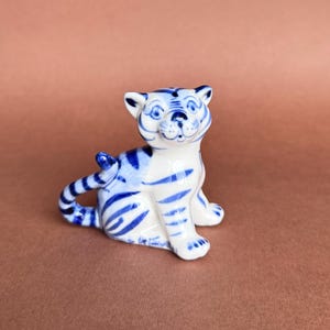Vintage figurine Tiger cub Gzhel. Porcelain figurine tiger