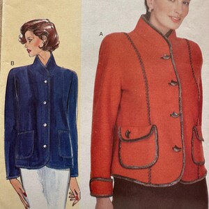 May include: A sewing pattern for a jacket with two different styles. The pattern includes instructions for a red jacket with a mandarin collar and a blue denim jacket with a button-up closure. The pattern is labeled with the letters A and B.