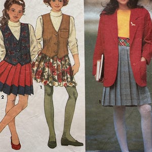 May include: A sewing pattern illustration featuring three outfits. One shows a dark floral vest with a red pleated skirt, another a brown vest with a floral skirt, and the third a red blazer over a yellow top and a grey plaid pleated skirt.