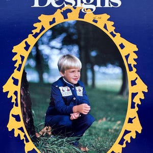 May include: Cover of "English Smocking Designs" leaflet. The cover features a young child in a blue outfit, framed by a yellow decorative border on a dark blue background. The title is in white, with the words "Little Miss Muffet" at the top.