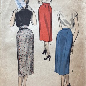 May include: A vintage sewing pattern featuring three different skirt styles. The first skirt is a red pencil skirt, the second is a blue skirt with a center slit, and the third is a patterned skirt with a black belt. The pattern is labeled "Sew-Easy" and includes the text "Hip 35".
