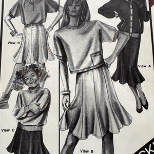 May include: A sewing pattern envelope featuring black and white illustrations of four different outfits labeled View A, B, C, and D. The text "MAKE IT IN MINUTES" is printed at the top. The designs include various skirts, tops, and jackets.