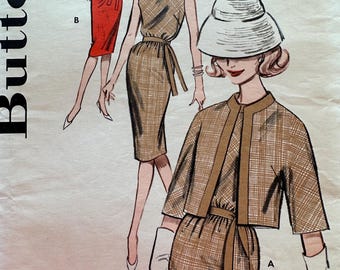 May include: Vintage sewing pattern for a dress and jacket. The pattern shows three different styles of the dress and jacket. The dress is a sleeveless sheath dress with a belt. The jacket is a cropped jacket with a collar and three-quarter sleeves. The pattern is from the 1960s and is in good condition.