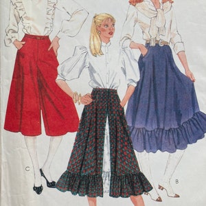 May include: A sewing pattern featuring three different styles of tops and skirts. The first outfit is a red, high-waisted, wide-leg pant with a white ruffled blouse. The second outfit is a plaid skirt with a white ruffled blouse. The third outfit is a blue skirt with a white ruffled blouse. The text on the pattern reads "Tops not included" and "Petticoat not included".