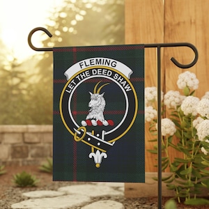 May include: A garden flag with the Fleming family crest, set against a green, navy, and red tartan background. The crest features a goat, the name "FLEMING," and the motto "LET THE DEED SHAW."
