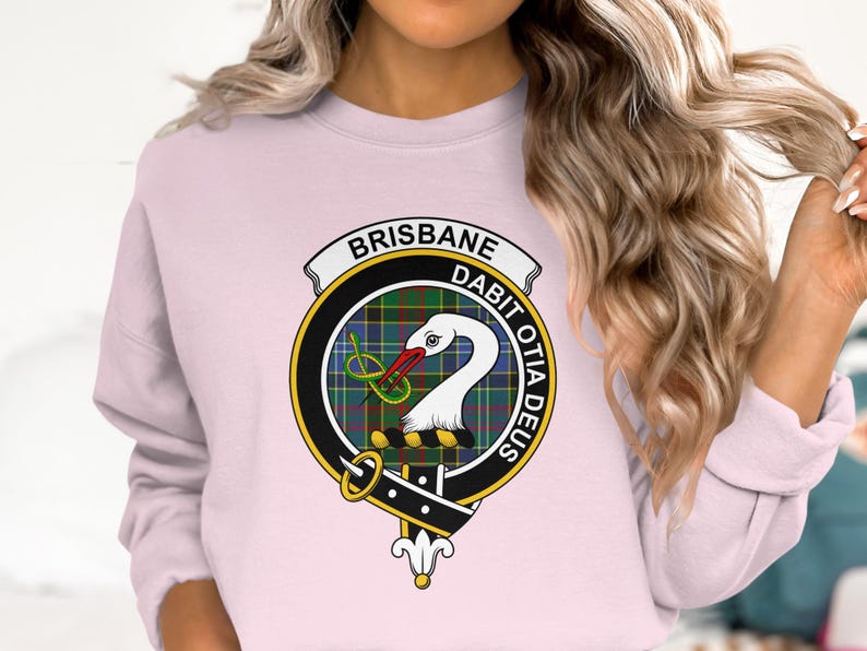 Pink sweatshirt with a Scottish clan crest featuring a swan and the words "BRISBANE" and "DABIT OTIA DEUS".