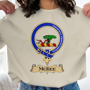 May include: A set of three ceramic mugs with a speckled, matte finish in cream, light grey, and dark grey. Each mug has a simple, minimalist design and a rounded handle. Suitable for coffee or tea, these mugs offer a modern aesthetic.