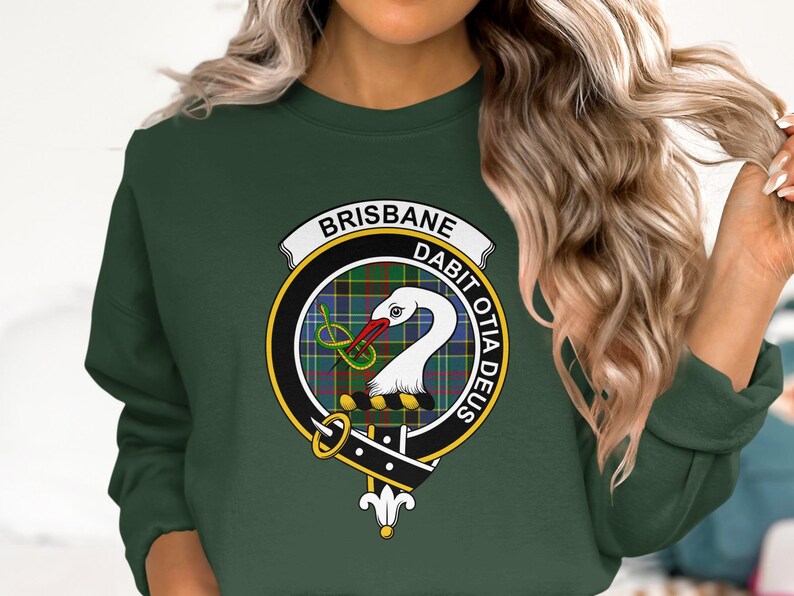 Green sweatshirt with circular crest for Brisbane Dabit Oda Deus.