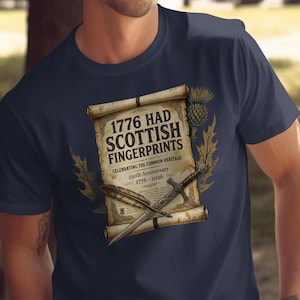 Navy t-shirt with scroll graphic: "1776 HAD SCOTTISH FINGERPRINTS" and thistle design.
