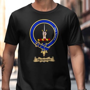 Black t-shirt featuring the McIntyre clan crest with motto "Per Ardua".