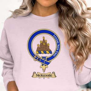 McKenzie clan crest and motto, "Lucem non uro."