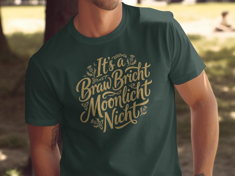 Dark green t-shirt with gold text saying "It's a Braw Bricht Moonlight Nicht".