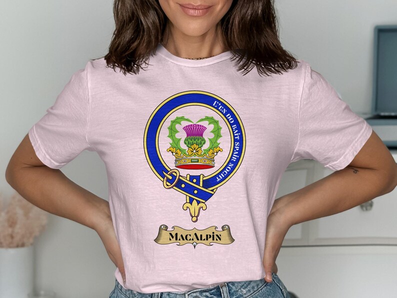 Pink t-shirt featuring the Macalpine clan crest with motto "E'en Do Bait Spair Noth".