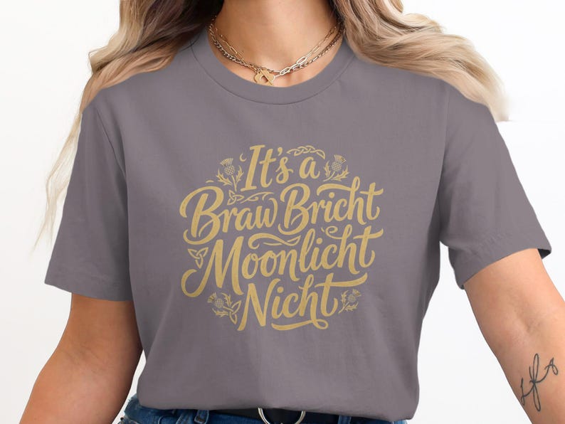 Grey t-shirt with "It's a Braw Bricht Moonlicht Nicht" in gold script.