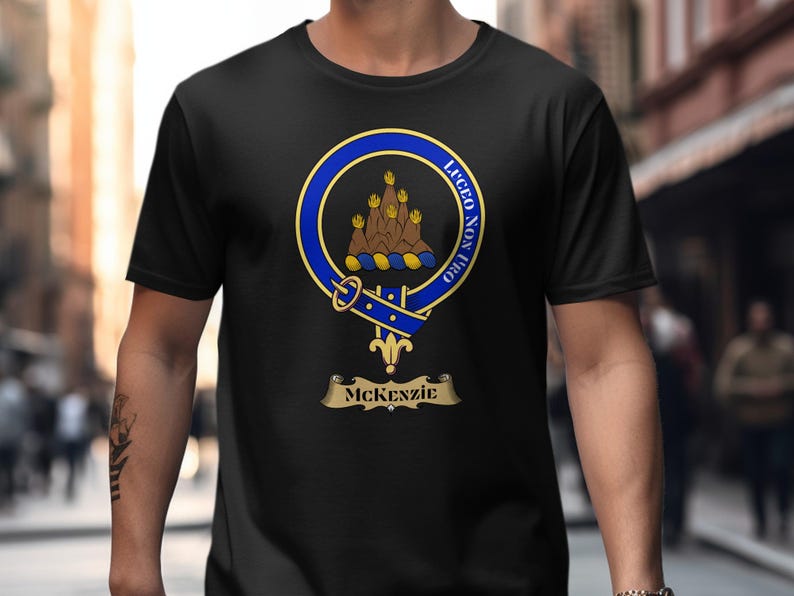 Black t-shirt with McKenzie clan crest featuring motto "Lucem Non Profero".