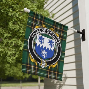 May include: A rectangular garden flag featuring a green, black, and yellow tartan pattern. In the center, a circular black belt emblem displays the text HOUSE OF O'SCANLAN and a shield with three blue lions on a white and blue divided field.